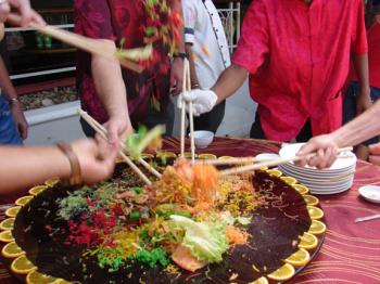 The Prosperity Toss salad and everyone shouting “Lo hei.”